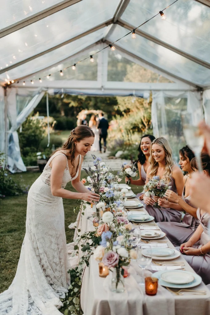 Soft lavender and muted neutral wedding reception with delicate wildflower centerpieces