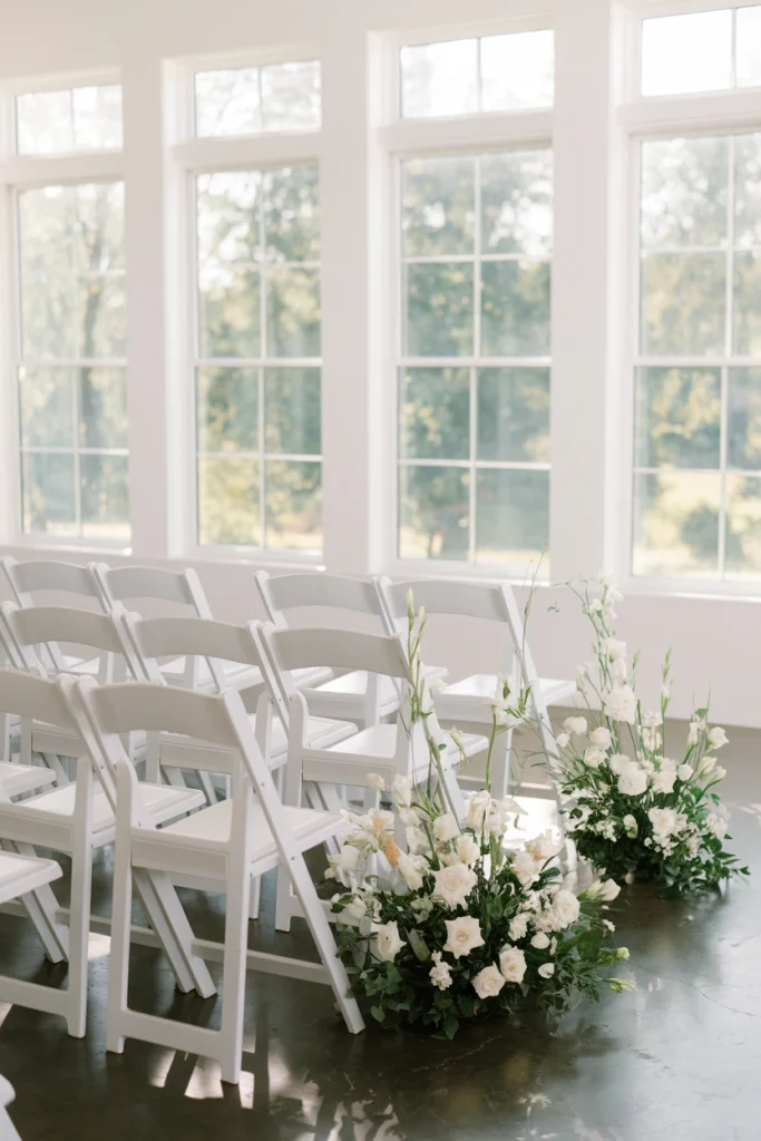 Intimate black and white micro-wedding ceremony set up in a home living room