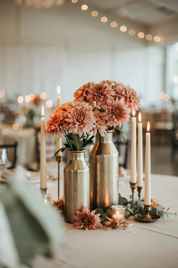 Terracotta rose ball centerpieces on a fall wedding reception table