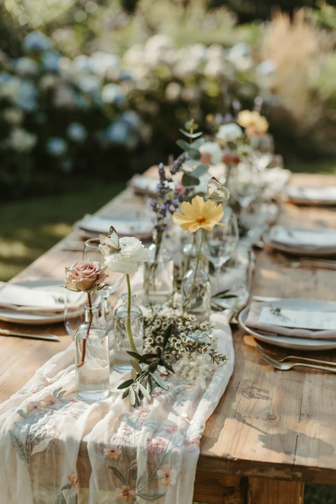 Sheer floral wildflower gauze table runner with bud vases
