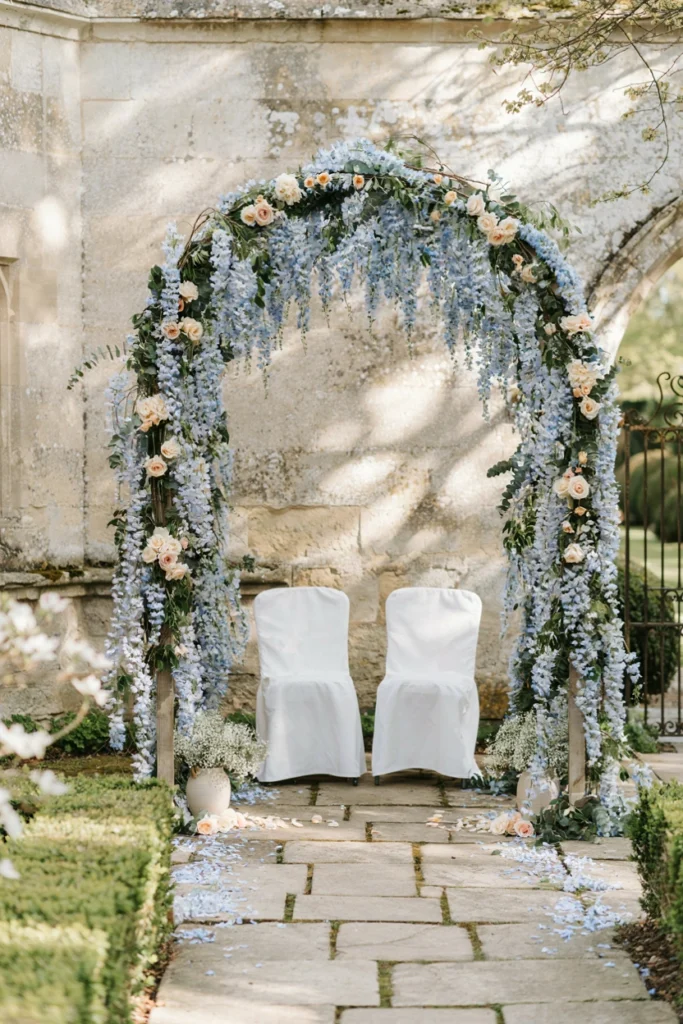 Cascading French blue wisteria wedding ceremony backdrop