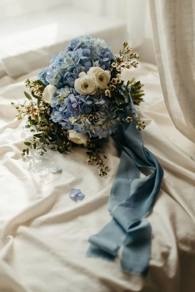 French blue hydrangea and white ranunculus bridal bouquet