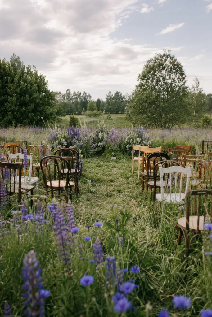 Wildflower meadow wedding ceremony with purple lupine and cornflower