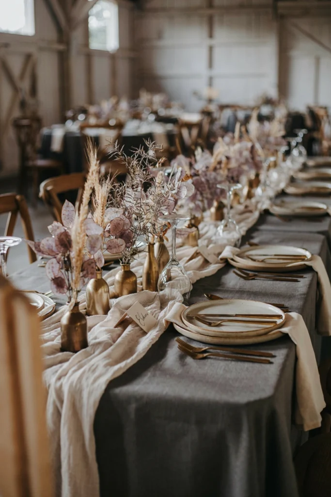 Charcoal linen wedding table with dried lunaria and wheat botanicals