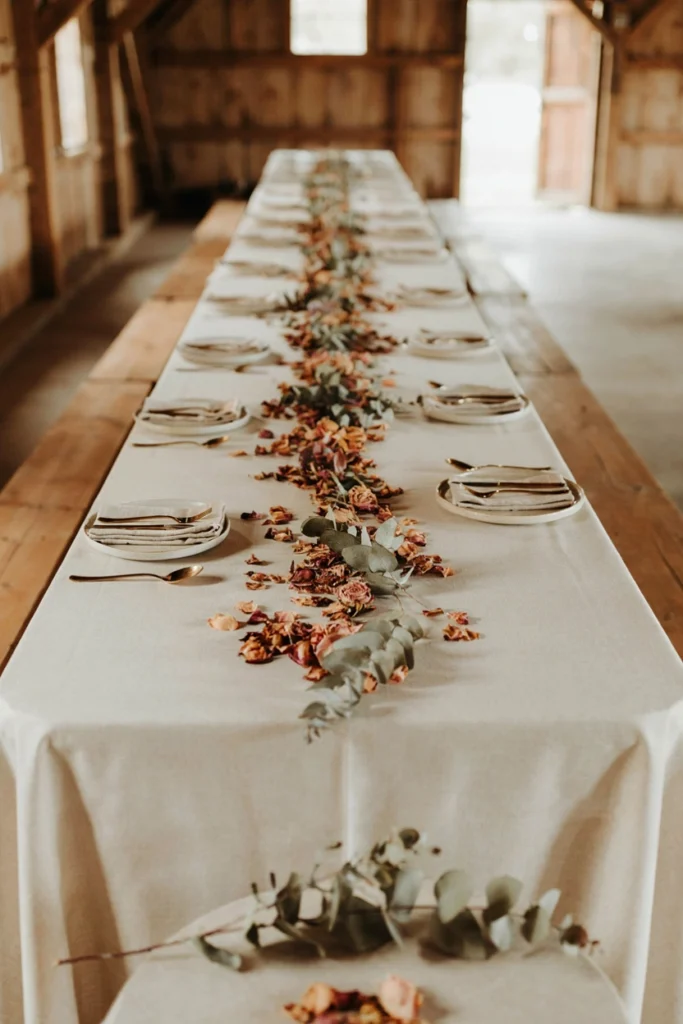 Dried rose petal and eucalyptus table runner for a winter wedding