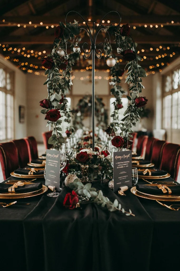 Black iron candelabra with trailing eucalyptus and ivy