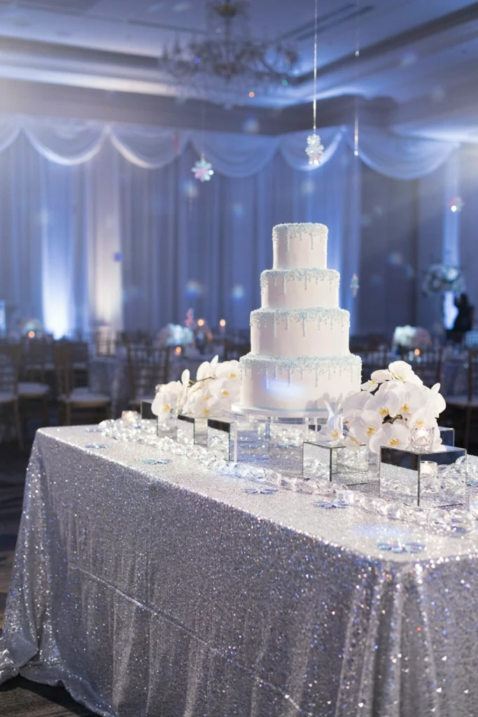 Wedding table dressed entirely in silver sequin linen catching the light