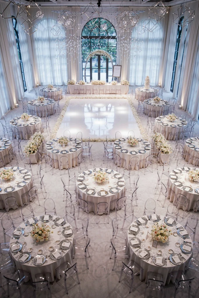 All white reception with acrylic and crystal details mimicking ice