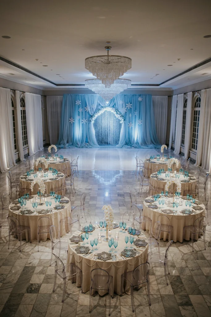 Overhead view of round wedding tables fanned in a horseshoe around an open dance floor