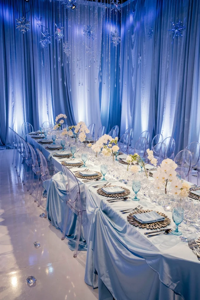 Small intimate wedding table set with silver flatware and a low crystal garland runner